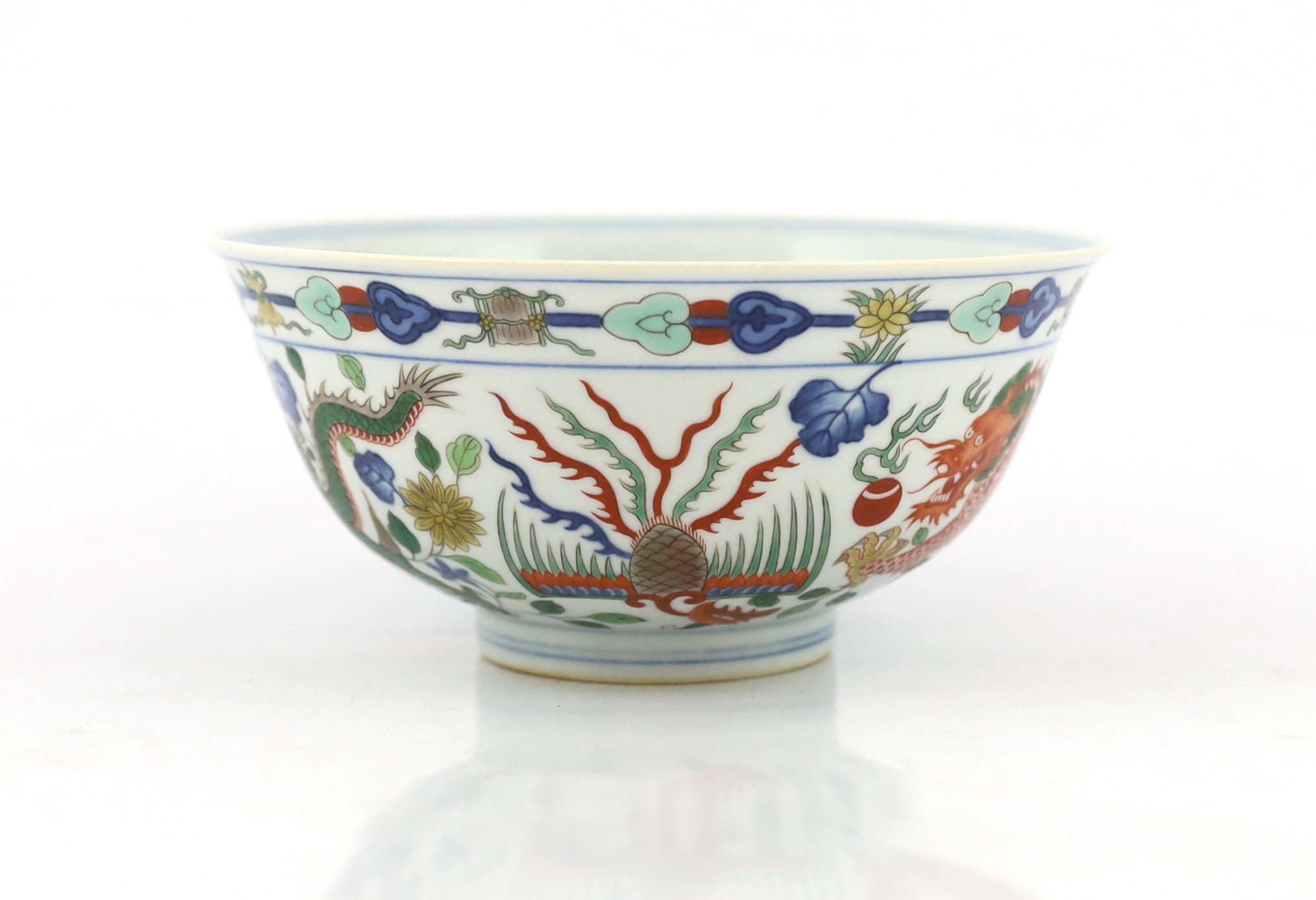 A Chinese wucai ‘dragon and phoenix’ bowl, Qianlong mark and possibly of the period